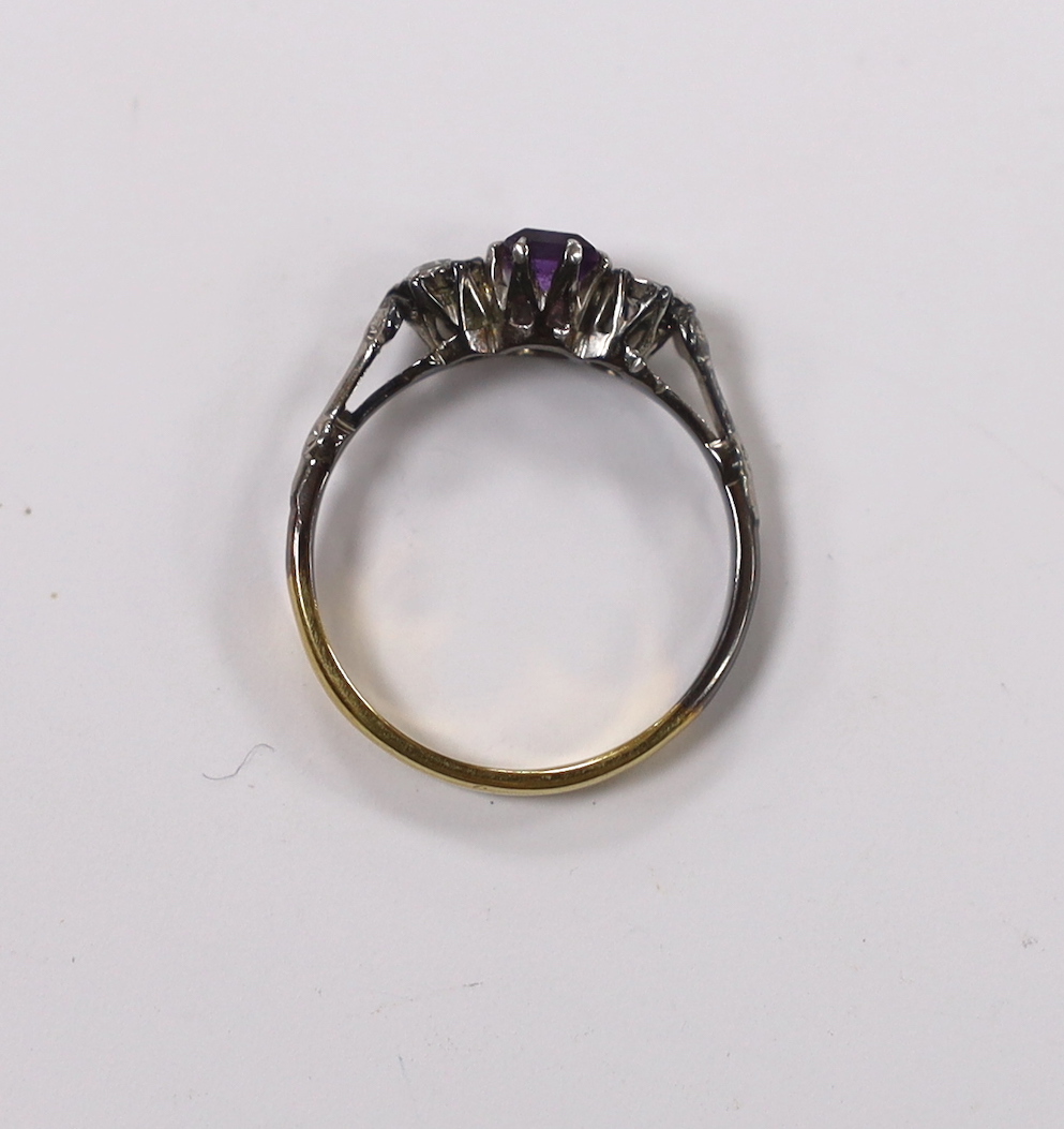 An early 20th century 18ct and plat. single stone amethyst and two stone diamond set ring, size K, gross weight 2.1 grams.